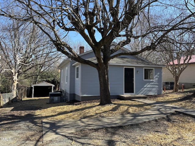 back of house featuring cooling unit