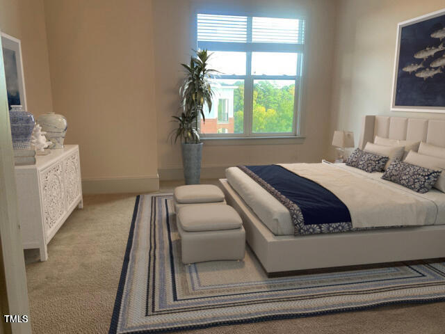 bedroom with carpet flooring and baseboards