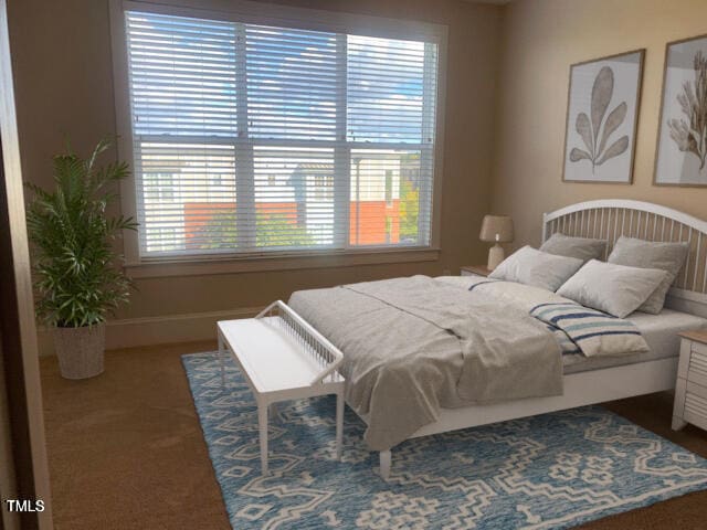 bedroom featuring carpet floors and baseboards