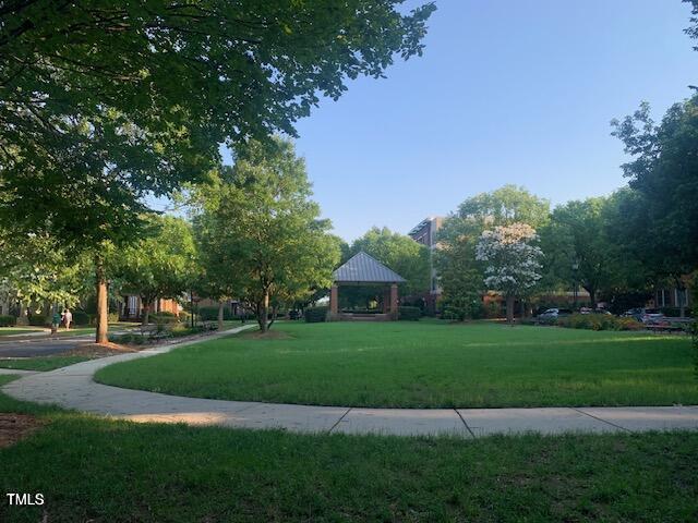 view of property's community featuring a lawn and a gazebo