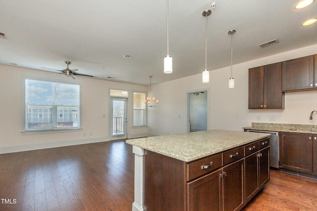 kitchen featuring a sink, visible vents, dark wood-style flooring, and stainless steel dishwasher