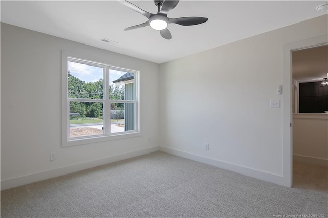 unfurnished room featuring carpet and ceiling fan