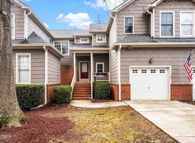 view of front of house with a garage and a porch