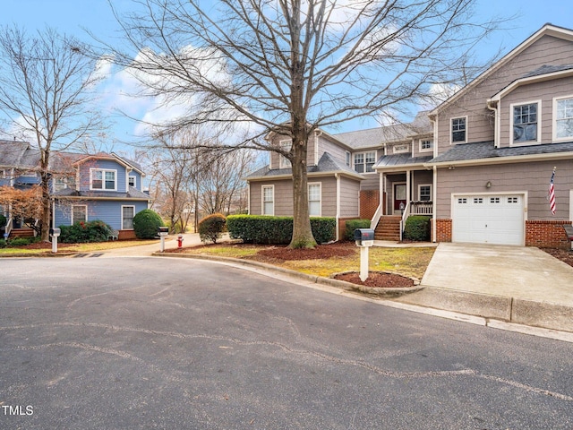 view of front of property with a garage and a porch