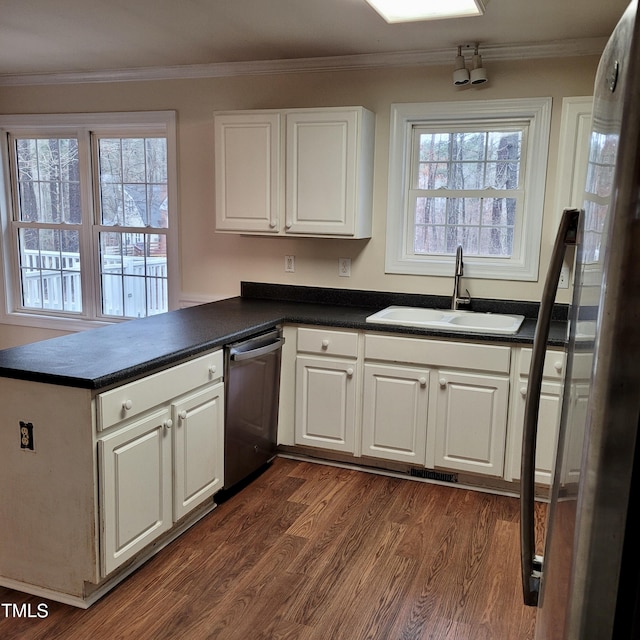 kitchen with dishwasher, sink, white cabinets, and kitchen peninsula