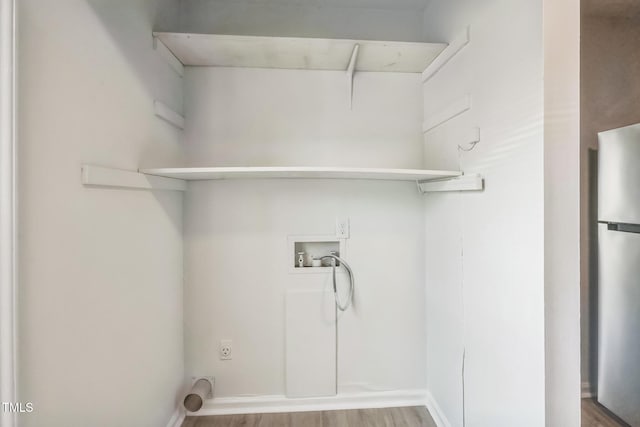 408 Cumbrian Ct, Fayetteville, NC 28314 - laundry area with hookup for a washing machine, wood finished floors, and hookup for an electric dryer