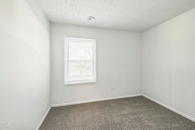 408 Cumbrian Ct, Fayetteville, NC 28314 - carpeted spare room with baseboards and a textured ceiling