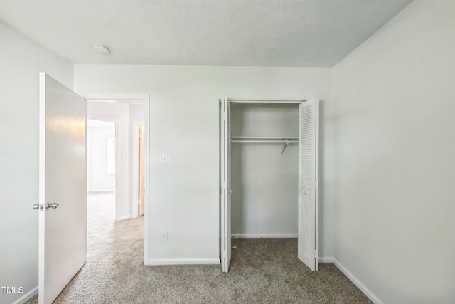 408 Cumbrian Ct, Fayetteville, NC 28314 - unfurnished bedroom with carpet floors, a closet, and baseboards