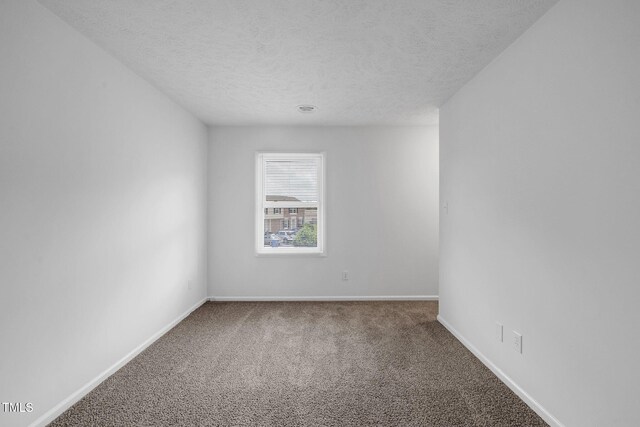 408 Cumbrian Ct, Fayetteville, NC 28314 - carpeted empty room with a textured ceiling and baseboards