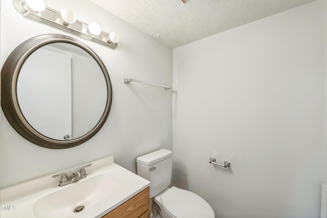 408 Cumbrian Ct, Fayetteville, NC 28314 - bathroom featuring toilet, a textured ceiling, and vanity