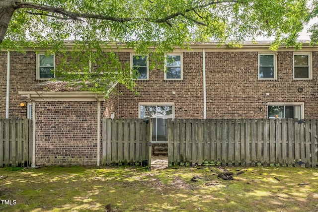 408 Cumbrian Ct, Fayetteville, NC 28314 - rear view of house with brick siding and fence
