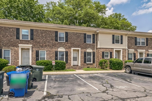 408 Cumbrian Ct, Fayetteville, NC 28314 - view of property with uncovered parking, brick siding, and entry steps