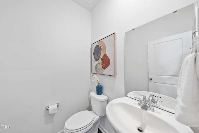 bathroom featuring a sink and toilet