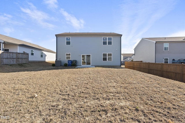 rear view of property featuring cooling unit and fence