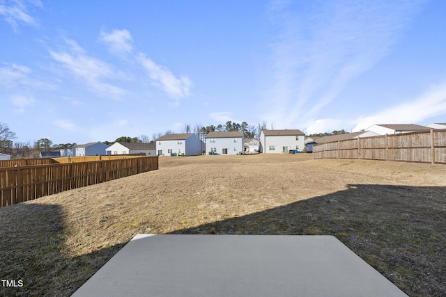 view of yard featuring a residential view and fence