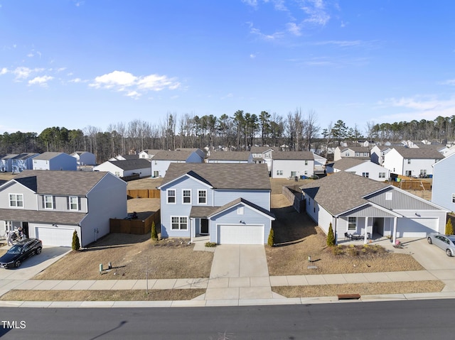 birds eye view of property with a residential view