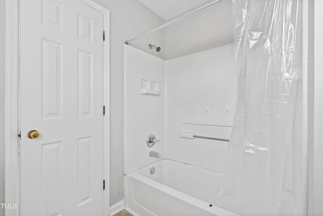 bathroom featuring shower / bath combination with curtain