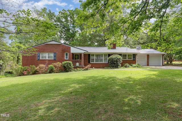 ranch-style home with a front yard, a chimney, brick siding, and an attached garage