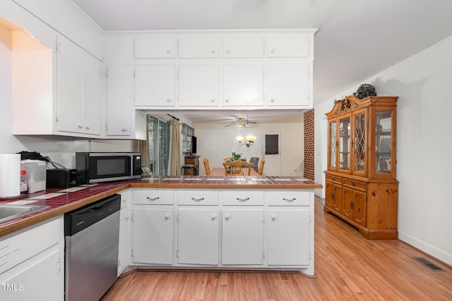 kitchen featuring appliances with stainless steel finishes, white cabinetry, a ceiling fan, and light wood-style flooring