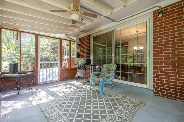 sunroom / solarium featuring ceiling fan