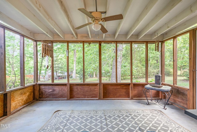 unfurnished sunroom featuring concrete floors