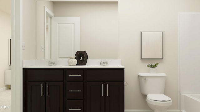 bathroom featuring vanity and toilet