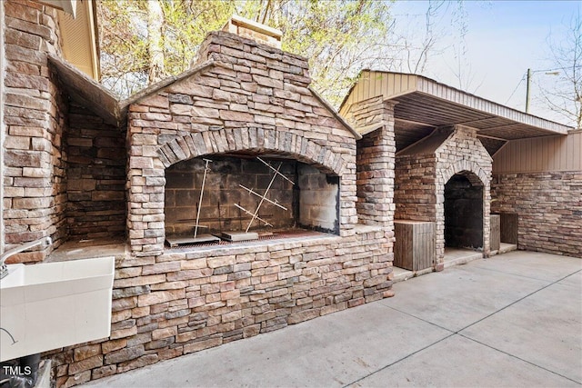 exterior space featuring exterior fireplace