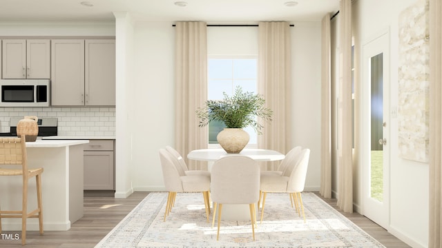 dining space featuring light hardwood / wood-style flooring