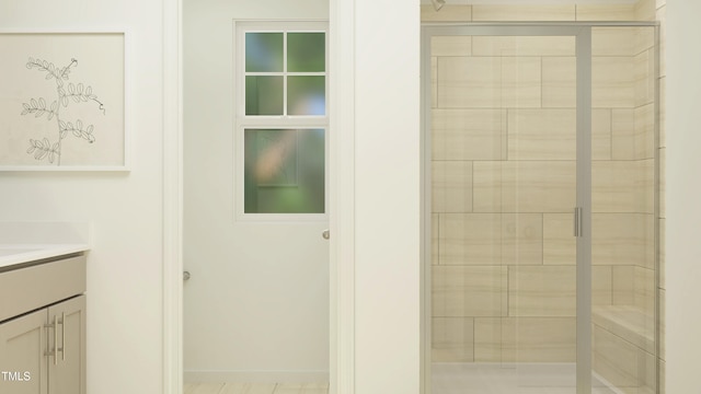 bathroom with vanity and a shower with shower door