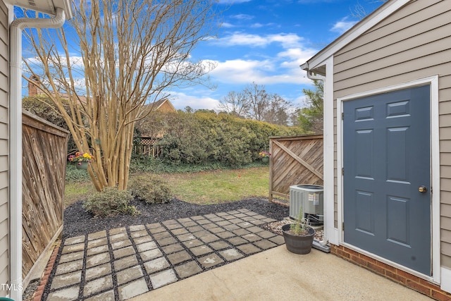 view of patio with a fenced backyard and cooling unit