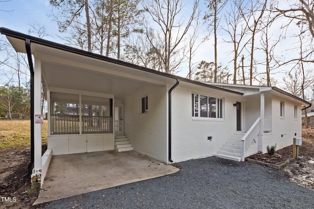 ranch-style house with a carport