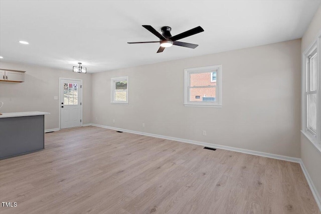 empty room featuring light hardwood / wood-style floors and ceiling fan