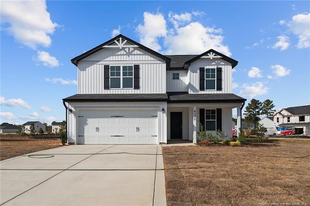 view of front of home featuring a garage and a front lawn