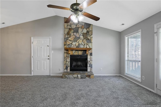 unfurnished living room with a fireplace, vaulted ceiling, ceiling fan, and carpet