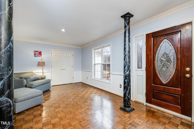 foyer entrance featuring crown molding and parquet floors