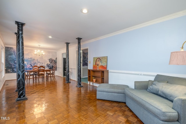 living room featuring ornamental molding, a chandelier, and parquet flooring