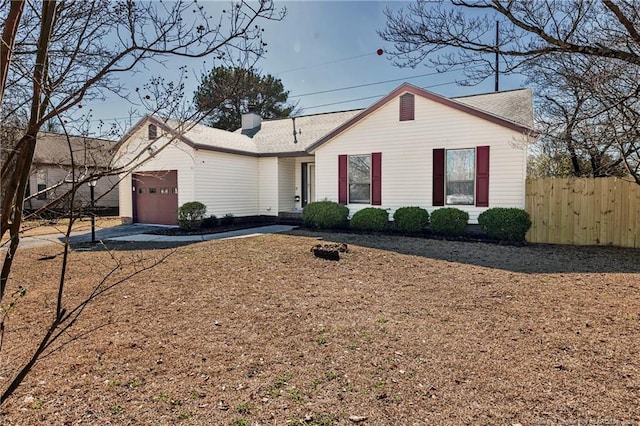 ranch-style home featuring a garage