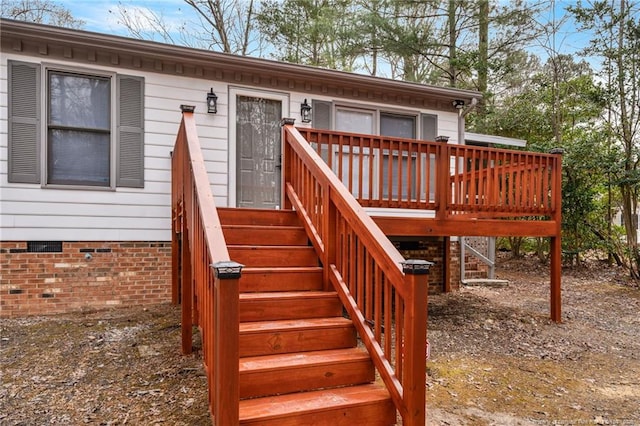 entrance to property featuring a deck