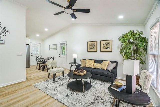 5802 Lillie Dr, Durham, NC 27712 - living area featuring ceiling fan, light wood-style floors, vaulted ceiling, crown molding, and baseboards