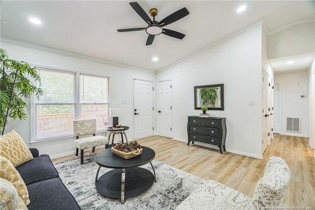 5802 Lillie Dr, Durham, NC 27712 - living area featuring vaulted ceiling, crown molding, a ceiling fan, wood finished floors, and baseboards