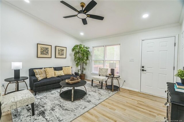 5802 Lillie Dr, Durham, NC 27712 - living area with ceiling fan, ornamental molding, light wood-type flooring, vaulted ceiling, and baseboards