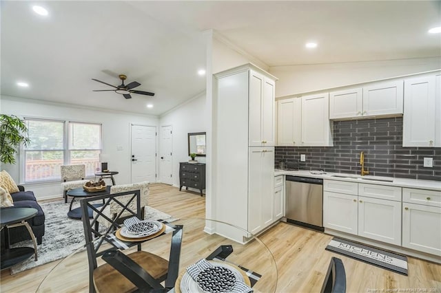 5802 Lillie Dr, Durham, NC 27712 - kitchen featuring a sink, stainless steel dishwasher, crown molding, a ceiling fan, and tasteful backsplash