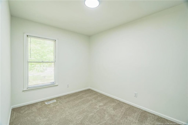 5802 Lillie Dr, Durham, NC 27712 - carpeted empty room featuring baseboards
