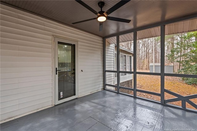 5802 Lillie Dr, Durham, NC 27712 - unfurnished sunroom with a ceiling fan