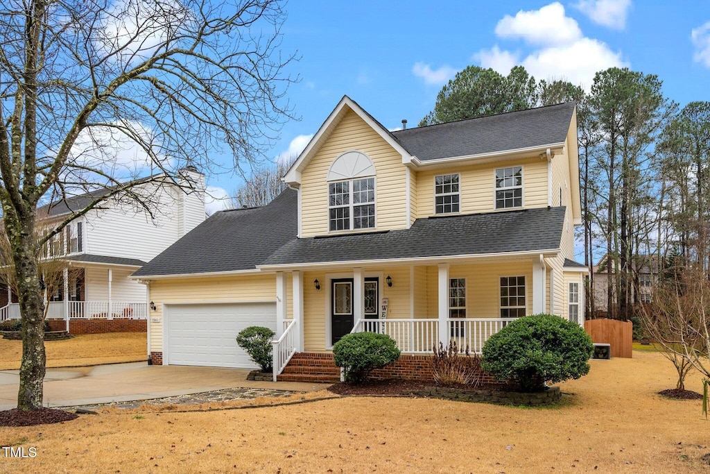 view of front facade featuring a garage and a porch