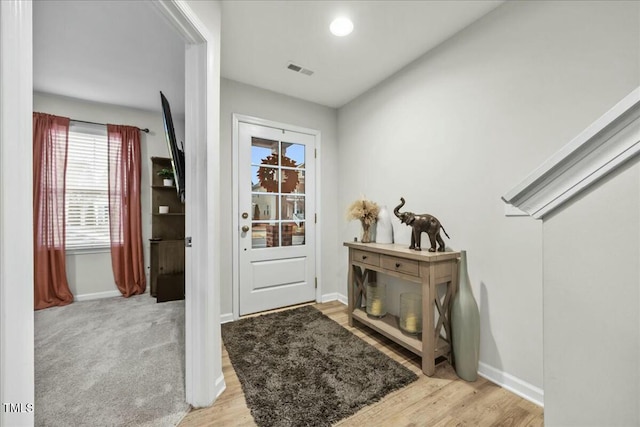 doorway to outside featuring light hardwood / wood-style flooring