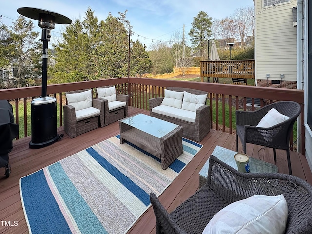 wooden deck featuring an outdoor hangout area