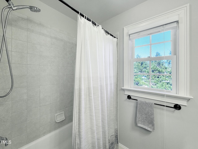 bathroom with shower / bath combo