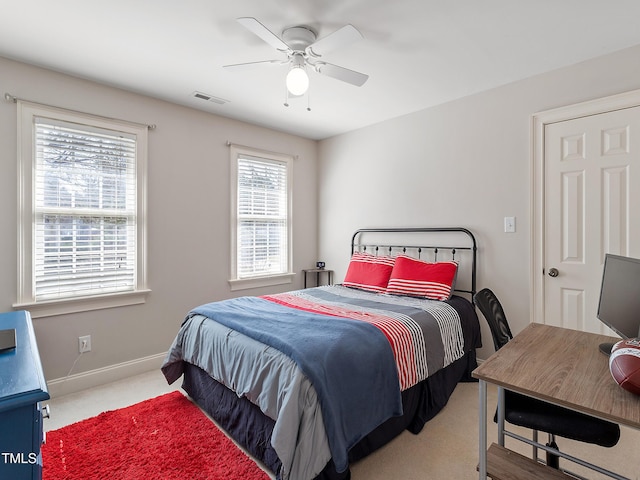 bedroom with a ceiling fan, carpet, visible vents, and baseboards