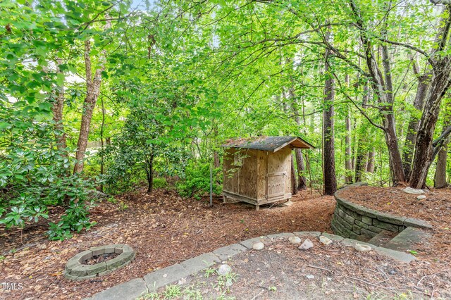 725 Littleleaf Ct, Holly Springs, NC 27540 - view of yard with a storage unit